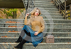 Fall fashion trend. Wearable trends. Layer oversize knit over girly skirt. Fall outfit formula. How to Style Sweater and