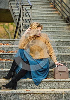 Fall fashion trend. Wearable trends. Layer oversize knit over girly skirt. Fall outfit formula. Style Sweater and Skirt