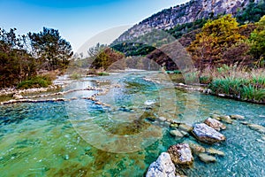 Fall foliage on the crystal clear Frio River in Texas. photo