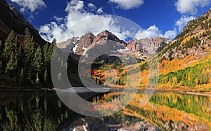 Fall foliage at scenic Maroon bells in Colorado photo