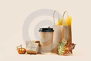 Fall Gift or Sale concept. Shopping paper bag, autumn decor.