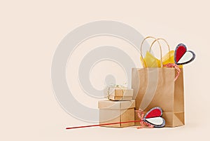 Fall Gift or Sale concept. Shopping paper bag, heart tag autumn decor.