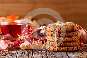 Fall harvesting on rustic wooden table with oat cookies