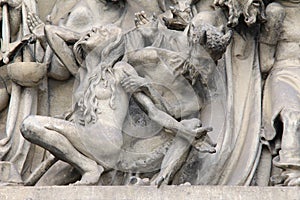 Fall into Hell - detail of the sculpture of the Last Judgment photo