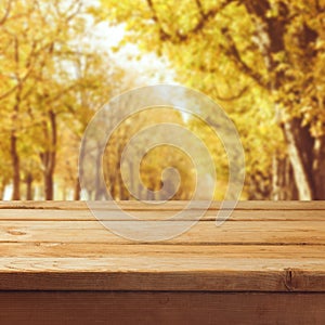 Fall nature background with empty wooden table