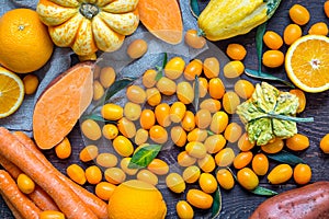 Fall Orange Fruits and Vegetables on Dark Wooden Background