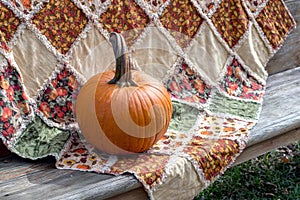 Fall Pumpkin and quilt, a beautiful autumn still life