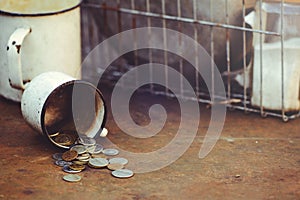 The fall of the Russian ruble, poverty and poverty scattered coins in the old circle on a rusty background, sanctions and the coll