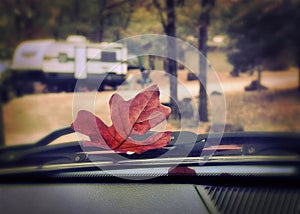 Fall RV Camping. Fallen leaf on vehicle.