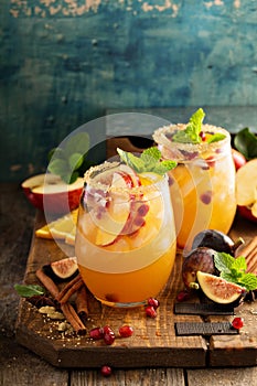 Fall sangria cocktail with apple, figs and orange