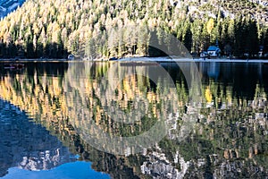 Fall scenery of lake Braies. Lago di Braies at Alps background in South Tyrol in Italy