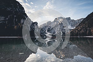 Fall scenery of lake Braies. Lago di Braies at Alps background in South Tyrol in Italy