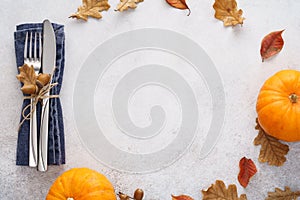 Fall season background with cutlery, leaves and pumpkins