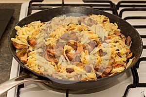 Fall season. Mushroom hunt. Saffron milk caps aka red pine mushrooms aka Lactarius deliciosus frying in a frying pan