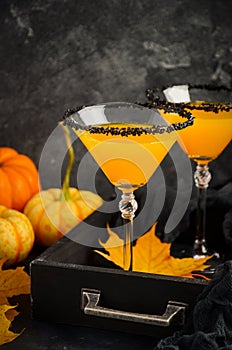 Fall Seasonal Cocktail Pumpkin Martini or Pumpkintini with Black Salt Rim photo