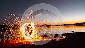 Fall Silhouette by the lake with Fire Light Painting