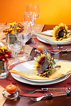 Fall theme dinner table set photo