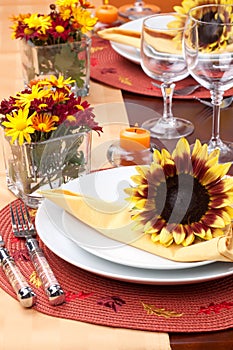 Fall theme dinner table set photo