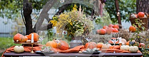 Fall themed holiday table setting arrangement for a seasonal party, banner