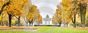 Fall trees in Jubelpark and Triumphal Arch in Brussels, Belgium.