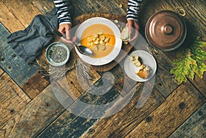 Fall warming pumpkin cream soup, copy space photo