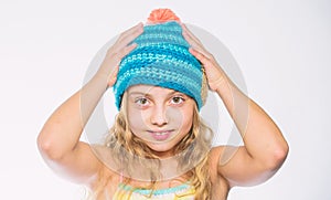 Fall winter season accessory. Free knitting patterns. Knitted hat with pompon. Girl long hair happy face white