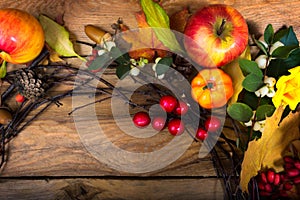 Fall wreath with pumpkins, apples, white red berries