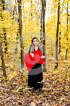 Fallen angel with red wings. Halloween