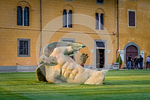 Fallen angel sculpture at Pisa central square
