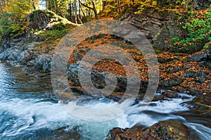 Autumn landscape with a river in the mountains