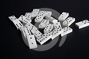 Fallen dominoes domino effect lose fail concept black background