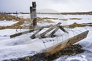 Fallen fence in Iceland photo