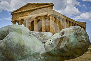 Fallen ikaro in front of concorde temple sicily