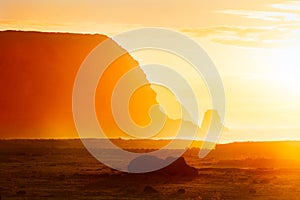 Fallen moai in golden haze in Easter Island