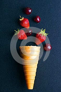 Fallen from the waffle cone fruit strawberries and cherries