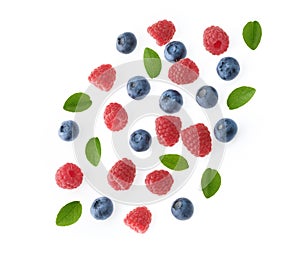 Falling berries of raspberry and blueberry white background