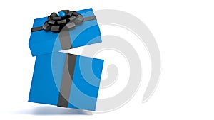 Falling blue gift box with black ribbon and bow isolated on white background and copy space.
