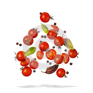 Falling cherry tomatoes with basil and spices on white background