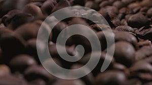 Falling coffee beans background with camera sliding forward