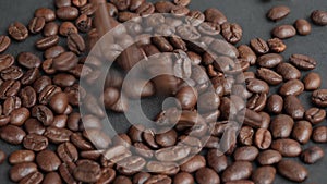 Falling Coffee Beans, Coffee grains are poured on the table and beat together