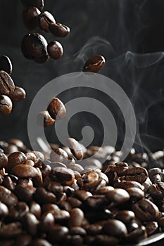 Falling coffee beans with steam