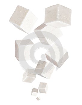 Falling cubes of soft cheese isolated on white background. Feta