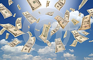 Falling dollars (sunny sky background) photo