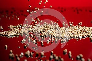 Falling dried buckwheat seeds for porridge