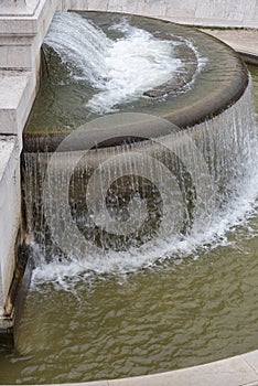 Falling drops down from the fountain in Rome.