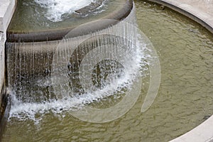 Falling drops down from the fountain in Rome.