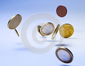 Falling euro coins. Symbol of wealth, accumulation or fall of the market, inflation and so on.