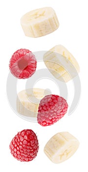 Falling fresh berries and banana isolated on white background