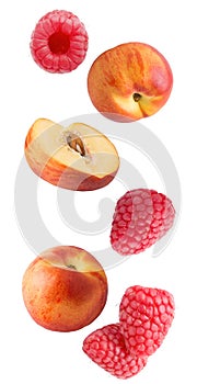 Falling fresh berries and peaches isolated on white background