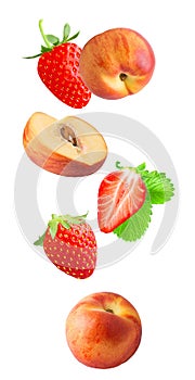 Falling fresh berriy and peaches isolated on white background